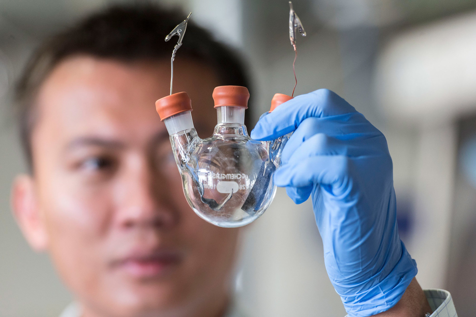 Yi Cui, director of Precourt Institute, holds up an experimental battery