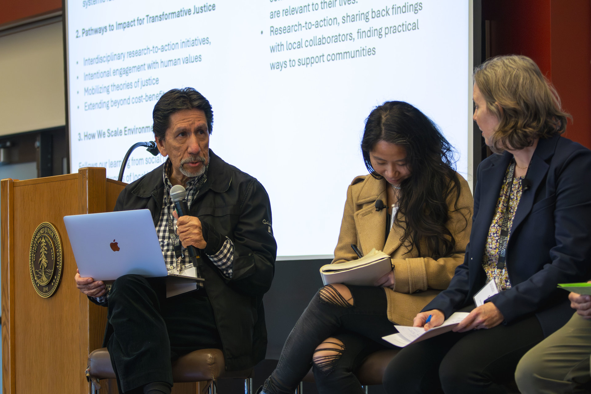 Rodolfo Dirzo (left) discusses highlights from the two-day conference on the “Duality of Environmental Justice” with Theresa Ong (middle), Sibyl Diver (right), and other panelists.